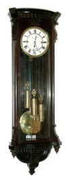 Simon Franklin in Wien, Austria, Vienna regulator, case with rosewood graining, door with scrolled corbels, bowed, fluted top with conforming cavetto cornice, bottom with curved moldings and applied carved drop, signed Roman numeral white enamel dial, pierced blued steel hands, brass, 8 days, 3 train grand sonnerie striking movement, polished brass pendulum and weights, c1860