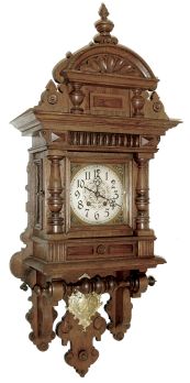 Lenzkirch, Germany, free swinger oak case with turned ornaments and shallow scroll carving, removable top with carved shell and central finial, Arabic numeral silvered dial, pierced, blued steel hands, 8 days, time and strike, movement, gilt pendulum with rococo style ornament and putto, serial #1,216,898, c1900