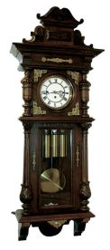 Germany, Vienna regulator, stained hardwood and walnut veneer case, architectural case with divided door, applied, carved split columns, removable carved crest, and applied stamped brass ornament, Roman numeral white enamel dial , pierced steel hands, brass 3 train, weight driven, 8 days, time and strike, movement with grand sonnerie striking, brass pendulum with ebonized wooden rod, and 3 brass weights, c1910