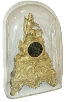 French, dore bronze figural clock, ARMY, an officer in full dress with bugle in left hand and a percussion rifle over his left shoulder, standing near a parapet, the clock itself tastefully off-center, the whole above a base of urns, swags and scrolls, and with a good old rectangular glass dome, c1840