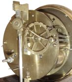 France, small mantel or table clock, rosewood veneered case with contrasting inlays and moldings, the front with thermometer mounted to an engraved silvered scale, gilt bezel with Roman numeral silvered dial, small seconds display at 12:00, blued steel Breguet style hands, 8 days, time and count wheel strike pendule a Paris movement signed "Robert a Paris", dead beat escapement, rosewood veneered base on turned feet, with glass dome, c1840