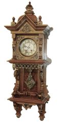 Lenzkirch, Germany, walnut open well or "Freischwinger", with built-in top and with approx 24 pieces of brass decoration, and the fancy cast pendulum depicting a lion