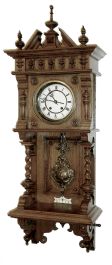 Lenzkirch, Germany, oak cased "Freischwinger", most similar to model 622 that is illustrated in several publications. Note barley twist columns on either side of the open well. Using the desirable Angel -- winged cherub pendulum that is illustrated in "150 Jahre Lenzkircher Uhren", page 136. Serial Nr. 1,037,868, circa 1894.