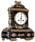 France, for Tiffany & Co., New York, small mantel clock, the Portoro marble case decorated with classically inspired gilt ornament, gilt bezel with deep convex glass, Arabic numeral white enamel dial, gilt hands with piercing and engraving, 8 days, time and strike, pendule a Paris movement marked "Vincenti", c1910