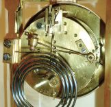 A.D. Mougin, French, 8 days, time and strike, spring brass movement oval brass and glass crystal regulator shelf clock with champleve enamel, c1900
