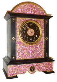 France, for Tiffany & Compy., New York, polished black slate case with porcelain panels bearing Adamesque style ornament on a matte gilt ground, the decoration with trailing vines, bellflowers, pendant husks and bowknots, the central panel with gilt bezel with beveled glass enclosing an Arabic numeral, black slate dial, and flanked by slate pilasters with incised gilt ornament, gilt hands, 8 days, time and strike, pendule a Paris movement, also signed Tiffany & Compy., c1880