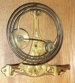 Lenzkirch, Germany, Vienna Regulator wall clock in the Alt Deutsche style, 8 days, time and strike, weight driven movement marked with Lenzkirch hallmark in an oak case with applied carvings, flat reeded columns flanking door, a pediment top, white enamel dial, serial number 1160521, c1897