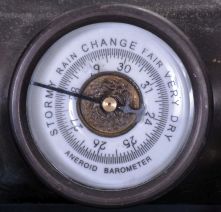 Reproduction Locomotive Clock: Detailed brass metal train model based on French Industrial series from the 1890s, time and strike clock with aneroid barometer and alcohol thermometer, all atop a black slate base with train track. Second spring driven movement in base is meant to power the wheels of the train.