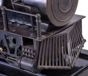 Reproduction Locomotive Clock: Detailed brass metal train model based on French Industrial series from the 1890s, time and strike clock with aneroid barometer and alcohol thermometer, all atop a black slate base with train track. Second spring driven movement in base is meant to power the wheels of the train.