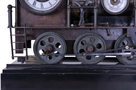 Reproduction Locomotive Clock: Detailed brass metal train model based on French Industrial series from the 1890s, time and strike clock with aneroid barometer and alcohol thermometer, all atop a black slate base with train track. Second spring driven movement in base is meant to power the wheels of the train.
