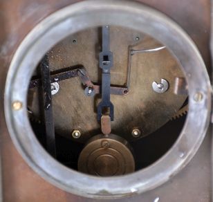 Reproduction Locomotive Clock: Detailed brass metal train model based on French Industrial series from the 1890s, time and strike clock with aneroid barometer and alcohol thermometer, all atop a black slate base with train track. Second spring driven movement in base is meant to power the wheels of the train.