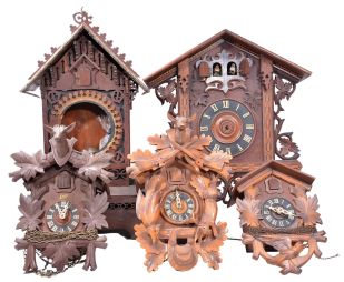 Clocks- 30 (Thirty) approximately German, Black Forest and Reproduction: including 20 (Twenty) modern German barometer, thermometer, clock combination in the form of a Swiss chalet, time and strike wooden works wag on wall, shelf cuckoo case only, Cuckoo and Quail wall clock American Cuckoo Clock Co., German porcelain wall clock and several modern and parts cuckoos, The lot includes a reproduction cast iron bank with soccer theme and a double singing bird in cage by Reuge.