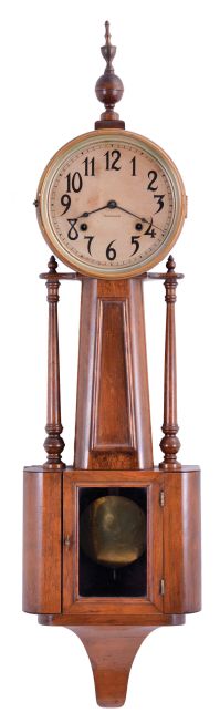 E. Ingraham & Co., Bristol, Conn., "Nile" banjo clock with a spring driven, 8 day, time and strike movement in a mahogany case.