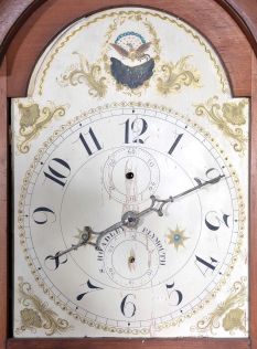 Tall Clocks- 4 (Four) and a tall clock case only: (1) English in a wide Yorkshire, short door case, the hood with mask for a 14" dial, 8 day movement with a 13" dial, c1840; (2) Monitor Clockworks mission style time only in oak; (3) S. Hoadley, Plymouth wooden works 30 hour, c1825; (4) Hutchinson, Douglas, Scottish in mahogany veneer case with Escape of Queen Mary" theme on dial including portraits of several famous Scottish poets, c1830; (5) English case only in walnut, c1850