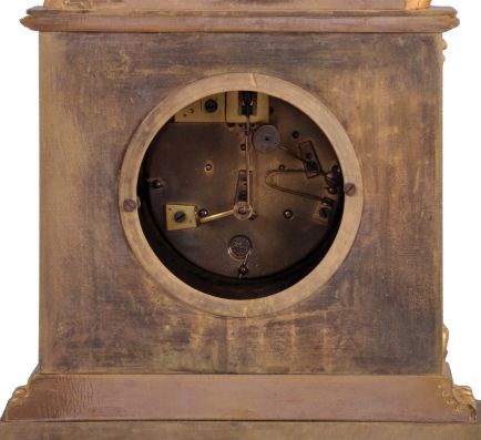 France, a mid 19th century figural mantel clock, gilt bronze case with rococo revival ornament, the top with a young woman with fancy dress and head scarf, resting against a stump, taking a rest from carrying her ewer, Roman numeral white painted dial, gilt Louis XV hands, 8 day pendule de Paris movement by Raingo Freres
