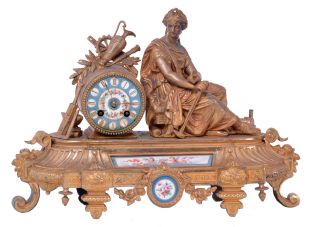 Japy Freres, Paris, France, figural mantel clock, 8 day time and strike, count wheel and bell, spring driven movement with floral themed ceramic dial and insets in a gilt spelter case featuring a seated female figure surrounded by symbols of art and science including a pitcher, gear, paintbrush & pallet, books, steam engine, anvil, spyglass, and square.