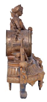 Japy Freres, Paris, France, figural mantel clock, 8 day time and strike, count wheel and bell, spring driven movement with floral themed ceramic dial and insets in a gilt spelter case featuring a seated female figure surrounded by symbols of art and science including a pitcher, gear, paintbrush & pallet, books, steam engine, anvil, spyglass, and square.