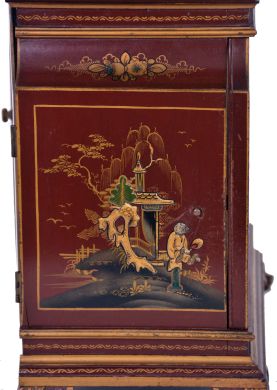 English, 8 day, time and strike spring driven, three train lever movement Westminster chime mantel clock in an Oriental-style gold and red Chinoiserie decorated case.