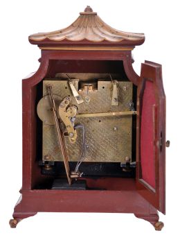 English, 8 day, time and strike spring driven, three train lever movement Westminster chime mantel clock in an Oriental-style gold and red Chinoiserie decorated case.