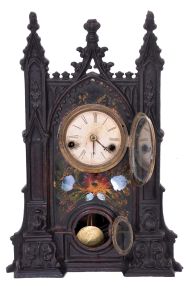 Unsigned Gothic style iron front shelf clock, attributed to the American Clock Co., NYC, with a 30 hour spring driven time and strike movement in a painted iron case with MOP inlay.