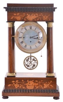 Austria, a mid 19th century portico clock with grand sonnerie striking, the case with rosewood veneers, ripple moldings, and contrasting, foliate marquetry, the columns with cast capitals and bases, Roman numeral silvered dial, blued steel hands, two day brass movement sounding the quarters in passing, and repeating the last hour and quarter on demand, silk suspended pendulum with engine turned rim, and decorative, pierced center