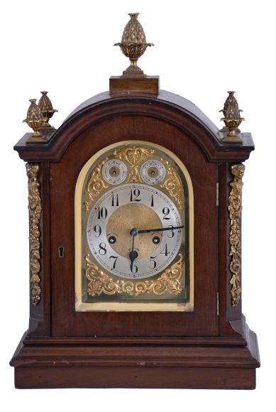 Germany, Junghans, 8 day, Westminster Chime, mahogany cased Georgian style bracket clock with fancy arched dial and pineapple finials