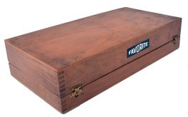 Favorite brand mainspring winder set in a wooden case. Set contains: one winding frame to be held in a bench vise, two cranks, and eight arbors with barrels. For use on clocks and music boxes.