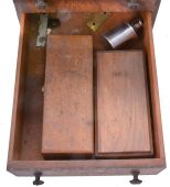 Assorted clock and watch tools in six drawer wood cabinet. Tools include a small bench vise, alcohol torches, truing calipers, pliers, tongs, files, hammers, screw plates, pin vises, screwdrivers, tweezers, 10 WW lathe collets, and other useful hand tools.