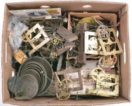 Clock parts including case parts, finials, old electric motors, clock keys, Connecticut time-and-strike movement parts, bells, and hundreds of new old stock clock hands.