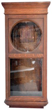 Cases- 2 (Two) wooden wall clock cases: (1) Dark mahogany case with arched glass and inner shelf; (2) Large oak clock with remains of electrical components on the backboard.
