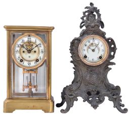 Clocks- 2 (Two) American: (1) Ansonia Clock Co., Brookline NY, "Prism" crystal regulator, 8 day time and strike, spring driven with visible escapement; (2) New Haven Clock Co., New Haven CT, "Arnold" metal case mantel clock, 8 day, time and strike with porcelain dial.