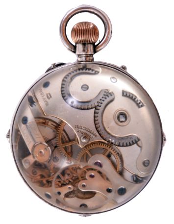 Switzerland, paperweight clock with calendar and phases of the moon, silver case mounted with transparent glass hemispheres, and with correctors for calendar and moon phases in the band, Roman numeral white enamel dial with subsidiary dials for the day, date, month, and seconds, blued steel hands, gilt, 30 hour, 11 jewel pin set movement with lever escapement, marked "Phoenix Indestructible", diameter 67mm