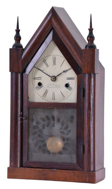 J. C. Brown, Forestville Manufacturing Co., Bristol, Conn., miniature steeple shelf clock with a 30 hour spring driven time and strike movement in a mahogany veneered case. Signed 30-hr time and strike movement.