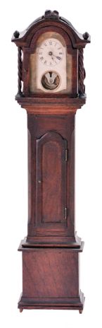 Miniature tall clock, mahogany case with removable bonnet, applied moldings, twist turned columns, and carved finials, Roman numeral paper dial with aperture below revealing the oscillating balance, 30 hour timepiece movement by the Yale Clock Co.