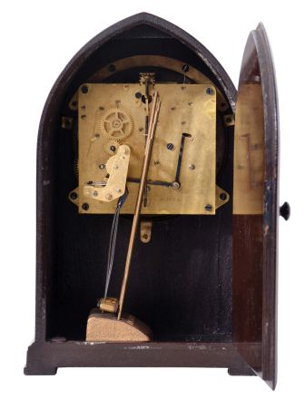 Seth Thomas Clock Co., Thomaston, Conn., "Chime No. 95" shelf clock with an eight day spring driven time and Westminster strike movement (124A) chiming on rods, in a two tone mahogany veneered case with a silvered dial and raised bronze numerals.