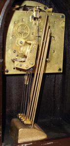 Seth Thomas Clock Co., Thomaston, Conn., "Chime No. 95" shelf clock with an eight day spring driven time and Westminster strike movement (124A) chiming on rods, in a two tone mahogany veneered case with a silvered dial and raised bronze numerals.