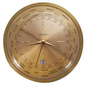 Le Coultre & Co., Switzerland, model 482 "World Time" desk clock, gilt case with convex glass, gilt dial with 34 cities around perimeter, and also with date display at 6:00, 8 day timepiece movement