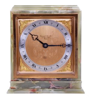 Elliott, London, for Garrard & Co., Ltd., shelf clock, rectilinear green onyx case with gilt bezel, gilt composite dial, blued steel trefoil hands, 8 day timepiece movement with lever escapement