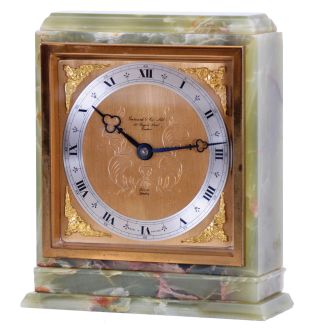 Elliott, London, for Garrard & Co., Ltd., shelf clock, rectilinear green onyx case with gilt bezel, gilt composite dial, blued steel trefoil hands, 8 day timepiece movement with lever escapement