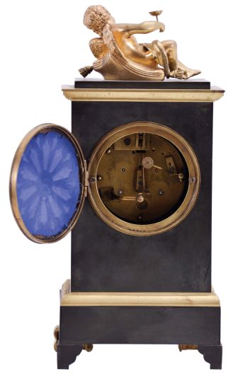 France, a small gilt and patinated bronze mantel clock in the Empire style, case with green patination and gilt mounts, surmounted by a reclining putto, Roman numeral, engine turned, silvered dial, blued steel Breguet style hands, 8 day, time and strike, pendule de Paris movement, signed Marti