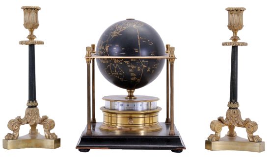 Franklin Mint/ Royal Geographical Society globe clock, ebonized base with slender columns at corners supporting an equatorial plate, turned brass clock case with annular dial supporting a terrestrial globe, 8 day Imhof movement, together with a pair of Empire style candlesticks with tripod bases, clock dimensions listed