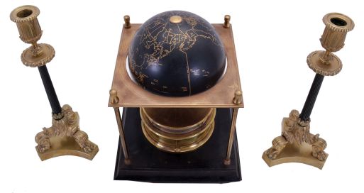 Franklin Mint/ Royal Geographical Society globe clock, ebonized base with slender columns at corners supporting an equatorial plate, turned brass clock case with annular dial supporting a terrestrial globe, 8 day Imhof movement, together with a pair of Empire style candlesticks with tripod bases, clock dimensions listed