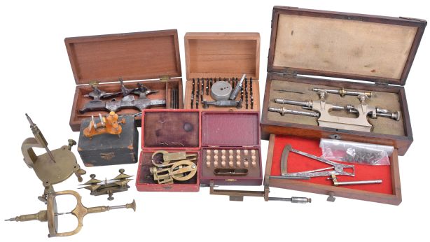 Watchmakers tools, including two uprighting tools, depthing tool, poising tool, set of punches, mainspring winder, poising caliper, steel turns with box, jacot tool with box, and more, all late 19th - early 20th century, Jacot tool box dimensions listed