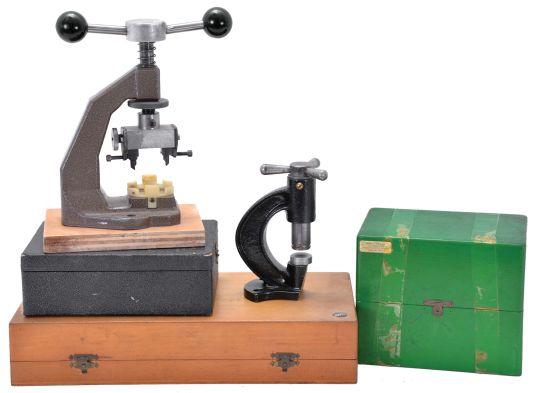 Watchmakers tools, including two Seitz jewelling tools, a Favorite jewelling g tool, a bench mounted watch case opener, and a small press, dimensions of largest jewelling tool box listed