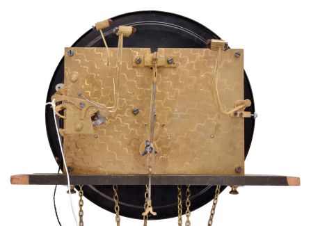 Germany, tall clock, 8 day, time, strike and chime on gongs, three embossed brass weight driven movement with matching pendulum bob in a dark oak case with beveled glass door and round top with convex glass and brass dial