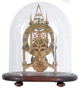 England, small Gothic skeleton clock, the pierced brass frame with 6 turned baluster form pillars, engraved Roman numeral brass dial, blued steel hands, and 8 day fusee timepiece movement, mounted to an oval mahogany base with glass dome.