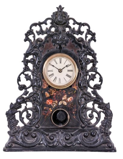 American Clock Co., New York, attribution fancy cast iron front mantel clock with an 8 day spring driven time and strike movement (marked S. Thomas, Plymouth, Conn.) .