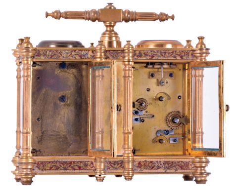 Victorian desk compendium of double carriage clock form, gilt brass case with turned feet, finials, and fluted columns, eight beveled glasses, and engraved panels with red enamel infill, the left side containing the clock, Roman numeral silvered dial, blued steel hands, 8 day time and alarm movement with lever platform, the right side with barometer and compass, both with silvered dials and blued steel indicators, case front also mounted with centigrade thermometer, case top with carrying handle