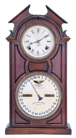 Ithaca Calendar Clock Co., Ithaca, NY, "No. 8 Shelf Library" with a spring driven 30 day Hubbell time only movement and a perpetual calendar mechanism in a walnut case.