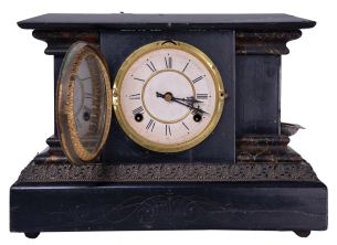 Waterbury Clock Co., Waterbury, Conn., "Dakota", 8 day, time and strike spring driven, lever movement black mantel clock. These clocks were bought by The Loheide Mfg. Co. and modified and sold as a "Trade Stimulator", - a gambling clock.